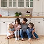 Family embrace in kitchen