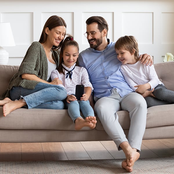 Family enjoys time together on the couch