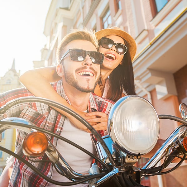 Couple has fun riding motorcycle together