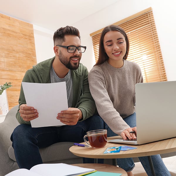 Young couple compares balances