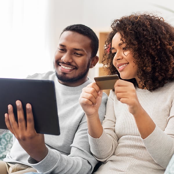 Young couple compare saving account options