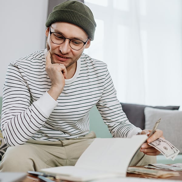 Young man compares savings options