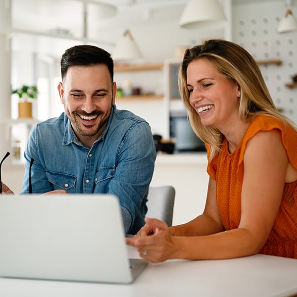 Couple looking at finances together on computer