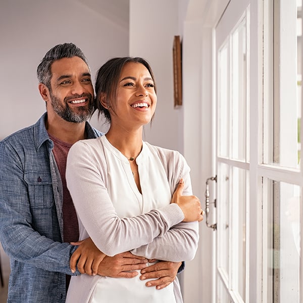 Couple smiles thinking about future