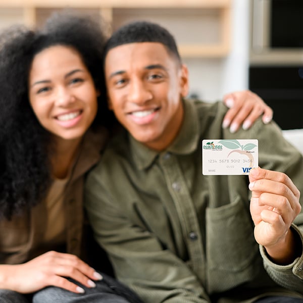 Young Couple show off their Peach State Credit Card