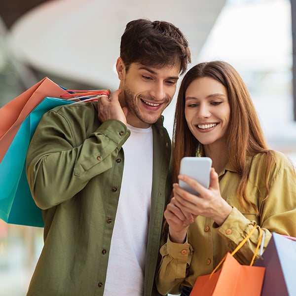 Young couple shop for clothes