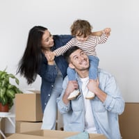 Happy parents with son in new home