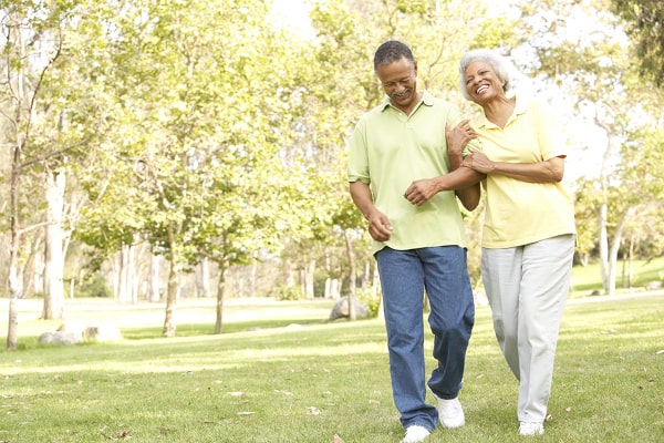 bigstock-Senior-Couple-Walking-In-Park-13909586