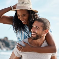 happy couple with Premium Checking Account on vacation
