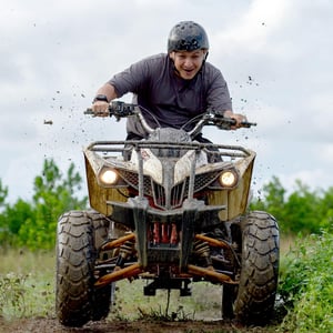man-riding-atv-with ATV Loan from Peach State FCU