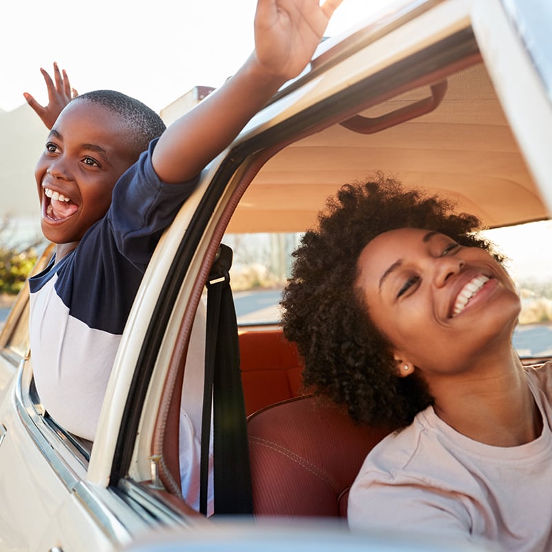 Mom and son enjoy car ride