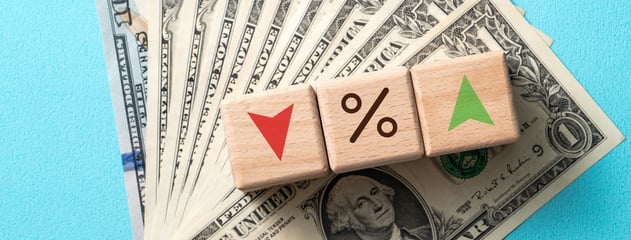 wooden-blocks-with-interest-rate-percent-bank-with-us-dollars-financial-world-economy-crisis-design-concept