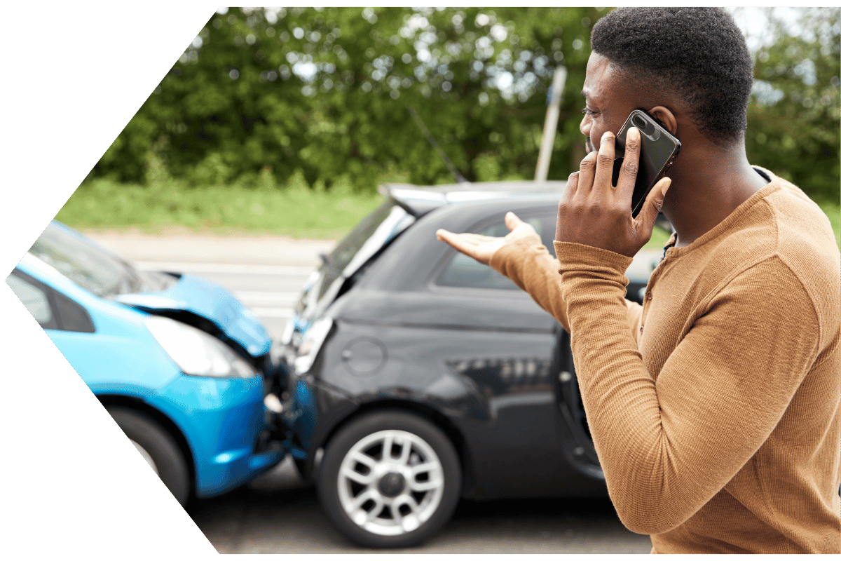 young man on the phone after accident his GAP insurance will help cover