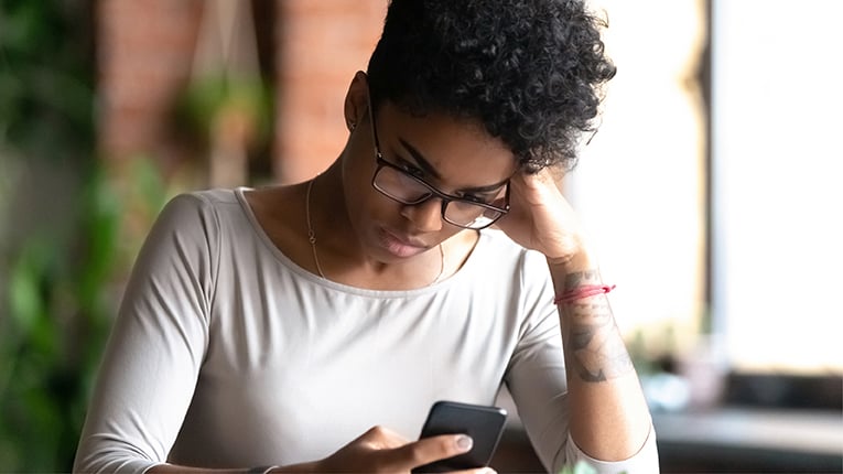 Mad biracial girl annoyed with smartphone problems