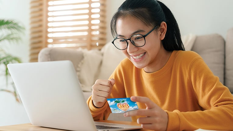Teen using CARES card to make online purchase