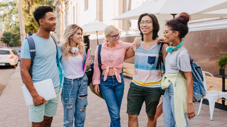 This-group-of-young-men-and-women-are-wondering-how-old-do-you-have-to-be-to-get-a-credit-card-as-they-hang-out-and-chat.