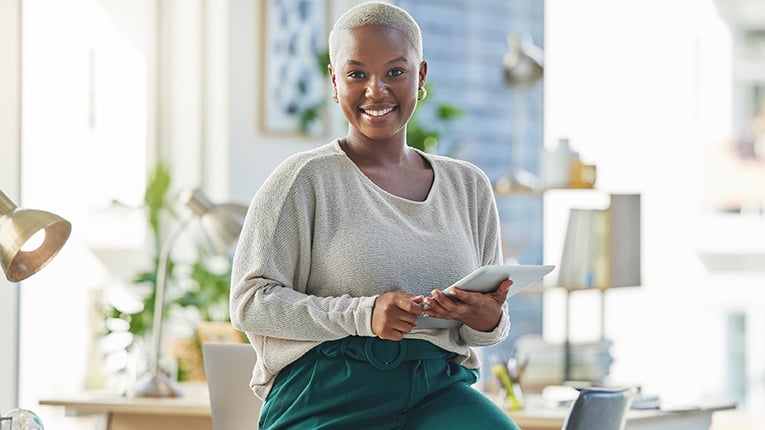 Shot of a young businesswoman using a digital tablet in her office