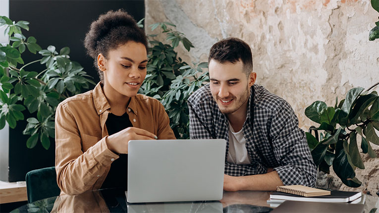 couple-on-laptop-after-consolidating-debt-with-a-personal-loan.